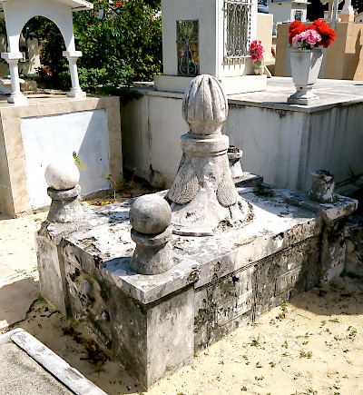 The empty grave of Fermin Antonio Mundaca y Marecheaga in the Isla Mujeres Cemetery. He is given credit for carving the skull and crossbones.