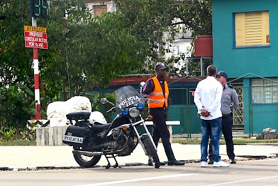 Cuban policemen guarding President Obama's motorcade route