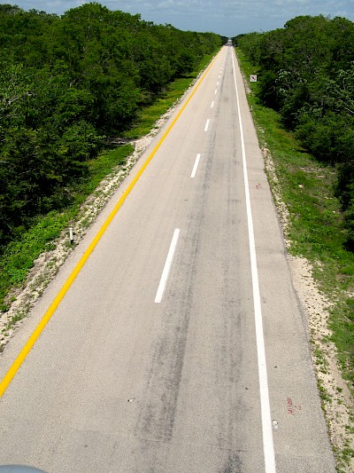 Stretch of the cuota between Cancun and Merida, illustrating the lowlands of the Yucatan Peninsula.